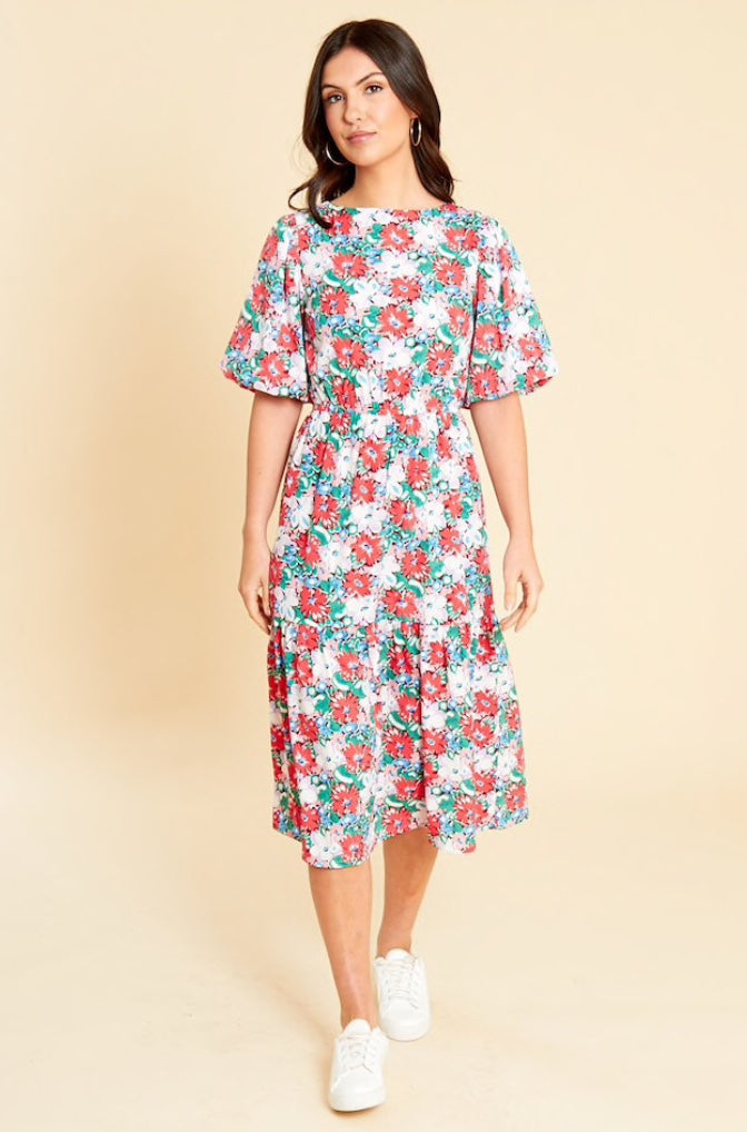 Red multi floral printed midi dress with short puff sleeves, drop hem and low back with tie detail