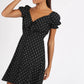 Black based white ditsy feather printed mini A-line dress with sweetheart neckline and puff sleeves