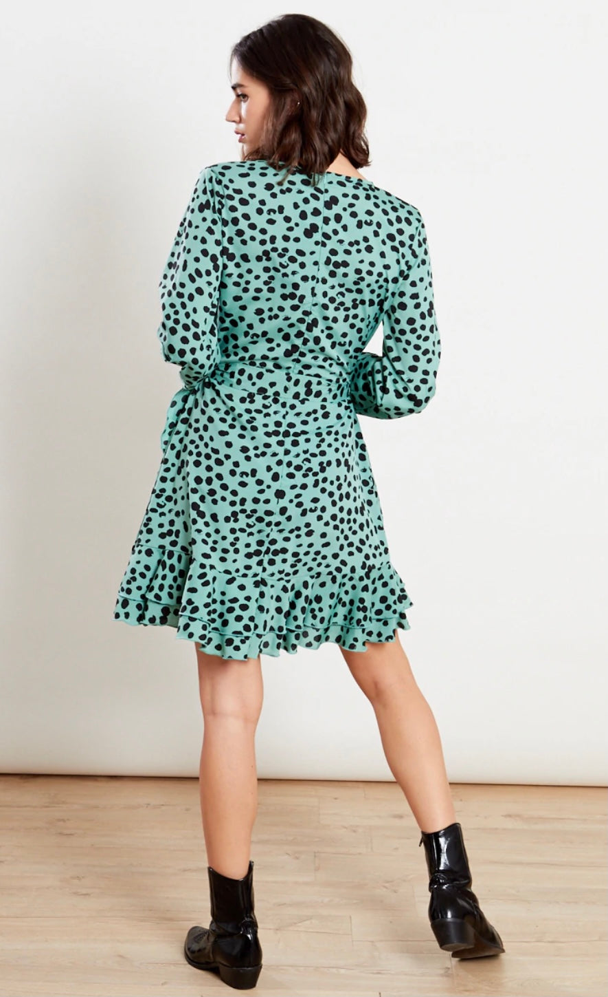 Dark mint green animal printed dress with wrap top, frill skirt and self fabric belt