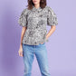 Light stone based black leopard printed peplum cotton top with frill peter pan collar and short puff sleeves